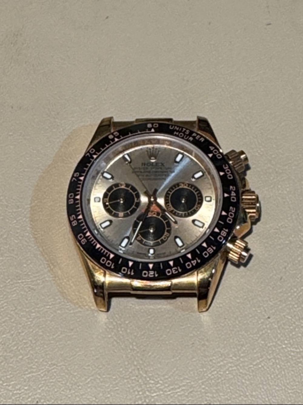 Daytona Men's Watch - Gold Tone Case with Black Bezel and Silver Dial